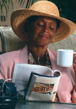 A woman sits in an passenger seat wearing a nasal cannula.